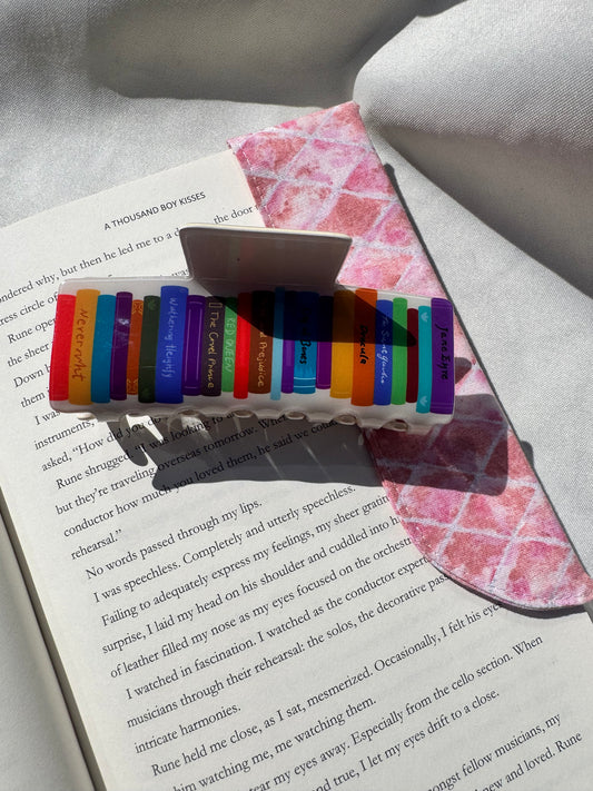 Hair claws -Stack of books