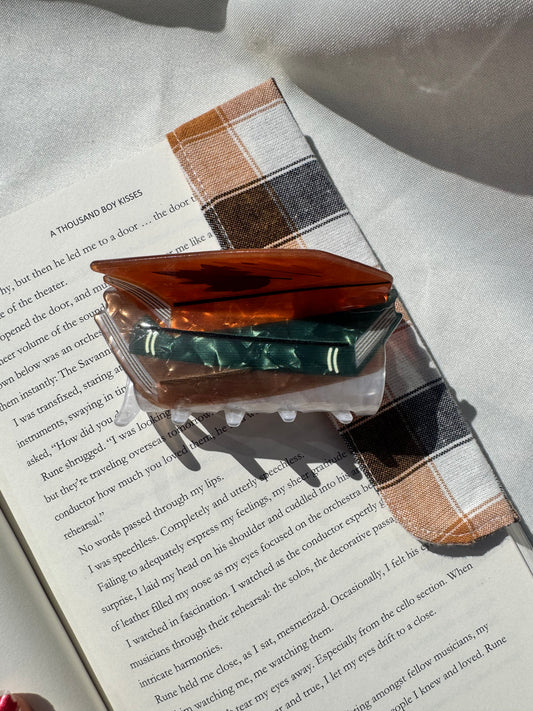hair claws- Stack of books