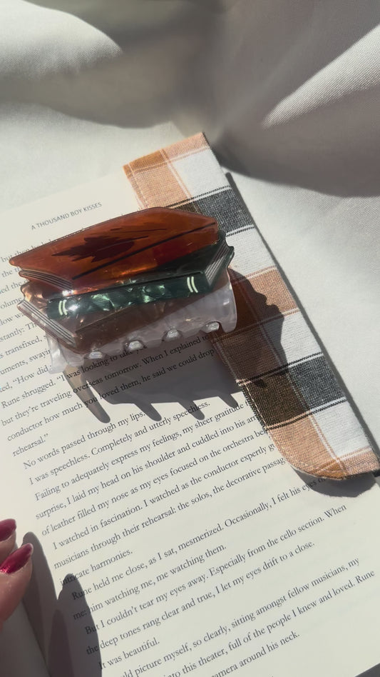 hair claws- Stack of books